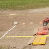 Radical Hunter moves to the outside lane on the back end of the track while Bear Foot crosses the finish line with a win