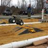 Grave Digger digs into the sand and pulls away from Wild Willy