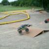 Dan DeFalco driving Grave Digger and getting sideways over the roller while lleading Bad Habit