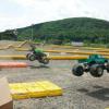 Monster Patrol and Thumper over the first jump. Monster Patrol was one of the fastest trucks on the track all weekend