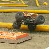 Monster Mutt has hard contact with the track protection barrier.